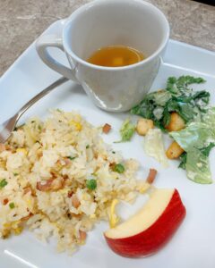 A dish of fried rice with miso soup